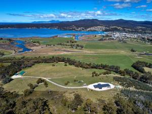 an aerial view of a park with a lake and a city at George River Park in St Helens