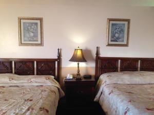 Postel nebo postele na pokoji v ubytování Traveller's Inn