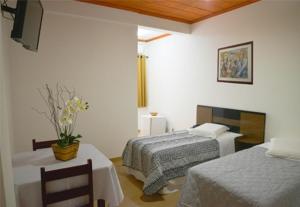 Un pat sau paturi într-o cameră la Rohedama Hotel