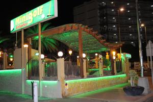 a gazebo with a sign on it at night at Solymar Las Olas in Playa del Ingles