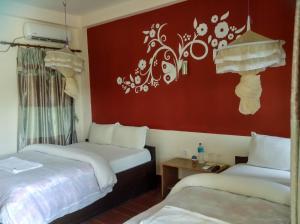 A bed or beds in a room at Eden jungle resort