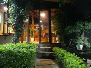 a house with a staircase leading to a front door at An Phu Homestay in Ninh Binh