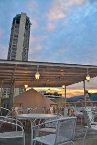 a group of tables and chairs on the roof of a building at Kimberley Hotel Georgetown in George Town
