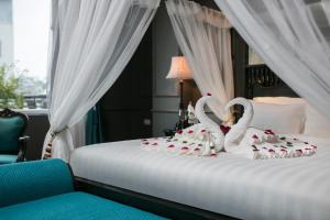 Voodi või voodid majutusasutuse Grande Collection Hotel & Spa toas