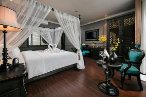 Voodi või voodid majutusasutuse Grande Collection Hotel & Spa toas