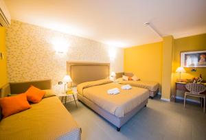 Postel nebo postele na pokoji v ubytování Albergo Athenaeum