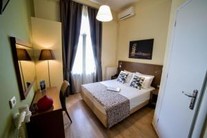 
Ένα ή περισσότερα κρεβάτια σε δωμάτιο στο Orestias Kastorias 
