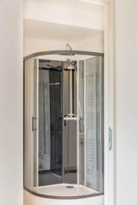 a mirror in a bathroom with a shower at La Maison de l'Orbière in Forcé +36 photos