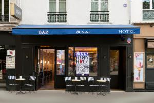 a store front with a sign on the front of it at Oh la la ! Hotel Bar Paris Bastille in Paris