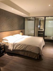Ένα ή περισσότερα κρεβάτια σε δωμάτιο στο City Suites - Taoyuan Station
