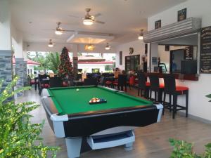 a pool table in the middle of a restaurant at Garden Village Resort in Moalboal