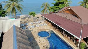 an aerial view of a resort with a swimming pool and the ocean at Lanta New Coconut Bungalow in Ko Lanta