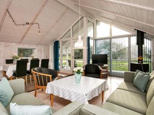 a living room with a table and chairs at 6 person holiday home in Thisted in Thisted