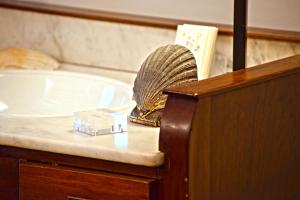 a bathroom with a tub and a fan on a counter at Sant Jaume in Alcudia