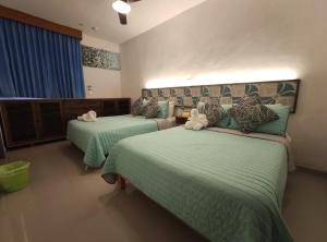 Postel nebo postele na pokoji v ubytování Kai Hotel