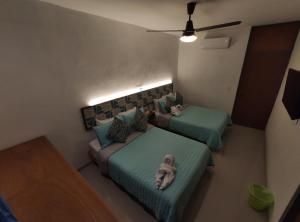 Postel nebo postele na pokoji v ubytování Kai Hotel