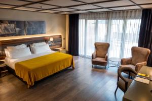 Hotel Nord 1901客房内的一张或多张床位