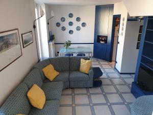 a living room with a couch and a table at Matteotti 134 in Sanremo