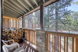 a screened in porch with a stack of logs at The Summit 276 in Mammoth Lakes