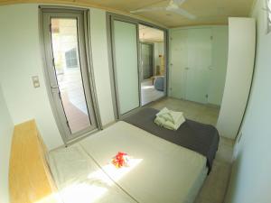 מיטה או מיטות בחדר ב-Aore Breeze