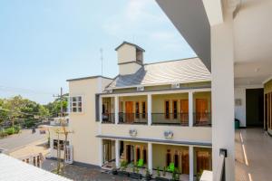 a view of a white building with a balcony at Rahayu Residence Syariah Kediri in Kediri