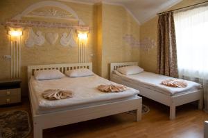 Postel nebo postele na pokoji v ubytování Trio Hotel Restaurant + 37 fotografií