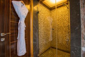 a bathroom with a shower with a glass shower stall at Lahoya Beirut in Beirut +34 photos