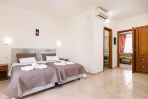 Postel nebo postele na pokoji v ubytování Villas Duc - Rhodes