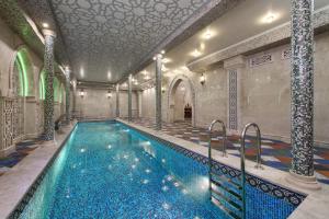 a large swimming pool in a large room at Bristol Spa-Hotel in Pyatigorsk