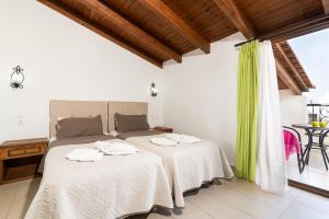 Postel nebo postele na pokoji v ubytování Villas Duc - Rhodes