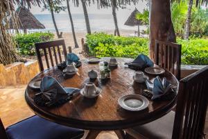 Ein Garten an der Unterkunft Pongwe Beach Hotel