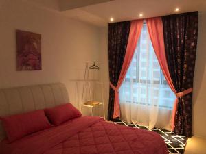 a bedroom with a bed and a large window at KJ Homestay Casa Kayangan in Ipoh +13 photos