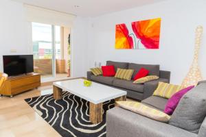 Et opholdsområde på Golden Gardens Duplex Apartment Javea Arenal by Rock Rentals