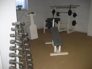 a room with a gym with a bunch of equipment at Hotel Kirchner in Tharandt