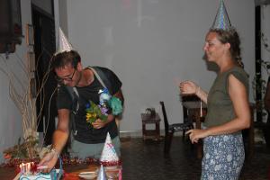 a man and a woman with party hats on top of a cake at Miheen Hotel & Resort - Anuradhapura in Mihintale