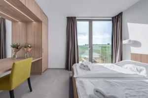 Postel nebo postele na pokoji v ubytování Apartmány HRÁDEČEK