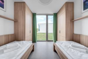 Postel nebo postele na pokoji v ubytování Apartmány HRÁDEČEK