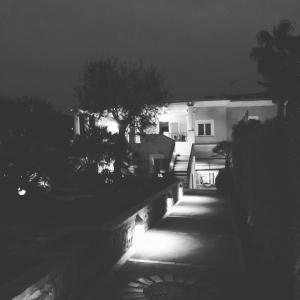a black and white photo of a house at night at Hotel Villa Ceselle in Anacapri