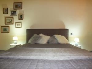 En eller flere senge i et værelse på Suite Mariasole