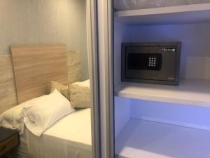 Ένα ή περισσότερα κρεβάτια σε δωμάτιο στο Asuncion Gracia Suites