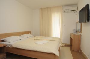 Postel nebo postele na pokoji v ubytování Hotel Anita