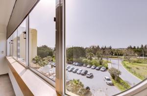 a view from a window of a parking lot at Hope House - 1 Bedroom - Vilamoura in Vilamoura