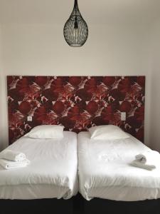 מיטה או מיטות בחדר ב-Les Terrasses de Bella Vista - Belle maison bord de mer