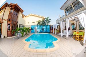 an image of a swimming pool in a house at Ndussole House in Talatona