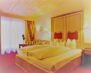Postel nebo postele na pokoji v ubytování Hotel Montana