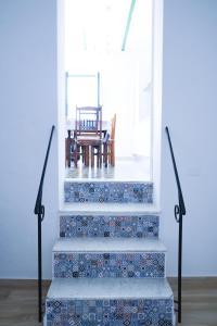 a set of stairs with a table and a chair at Casa Cardi in Sperlonga
