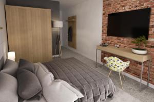 Telewizja i/lub zestaw kina domowego w obiekcie ApartHOTEL Gostyń