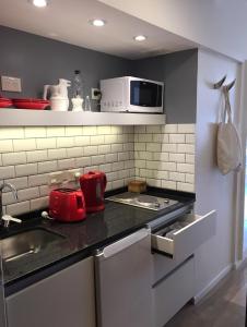 Virtuvė arba virtuvėlė apgyvendinimo įstaigoje Moderno apartamento en excelente ubicación