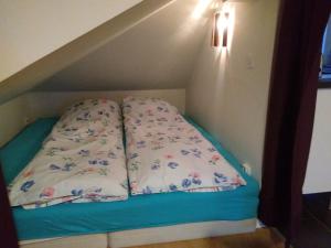 a bed in the corner of a room at Honeymoon Seaview Apartment in Helsingborg