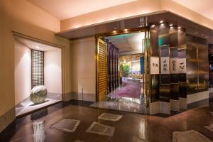 Postel nebo postele na pokoji v ubytování Hotel New Otani Makuhari